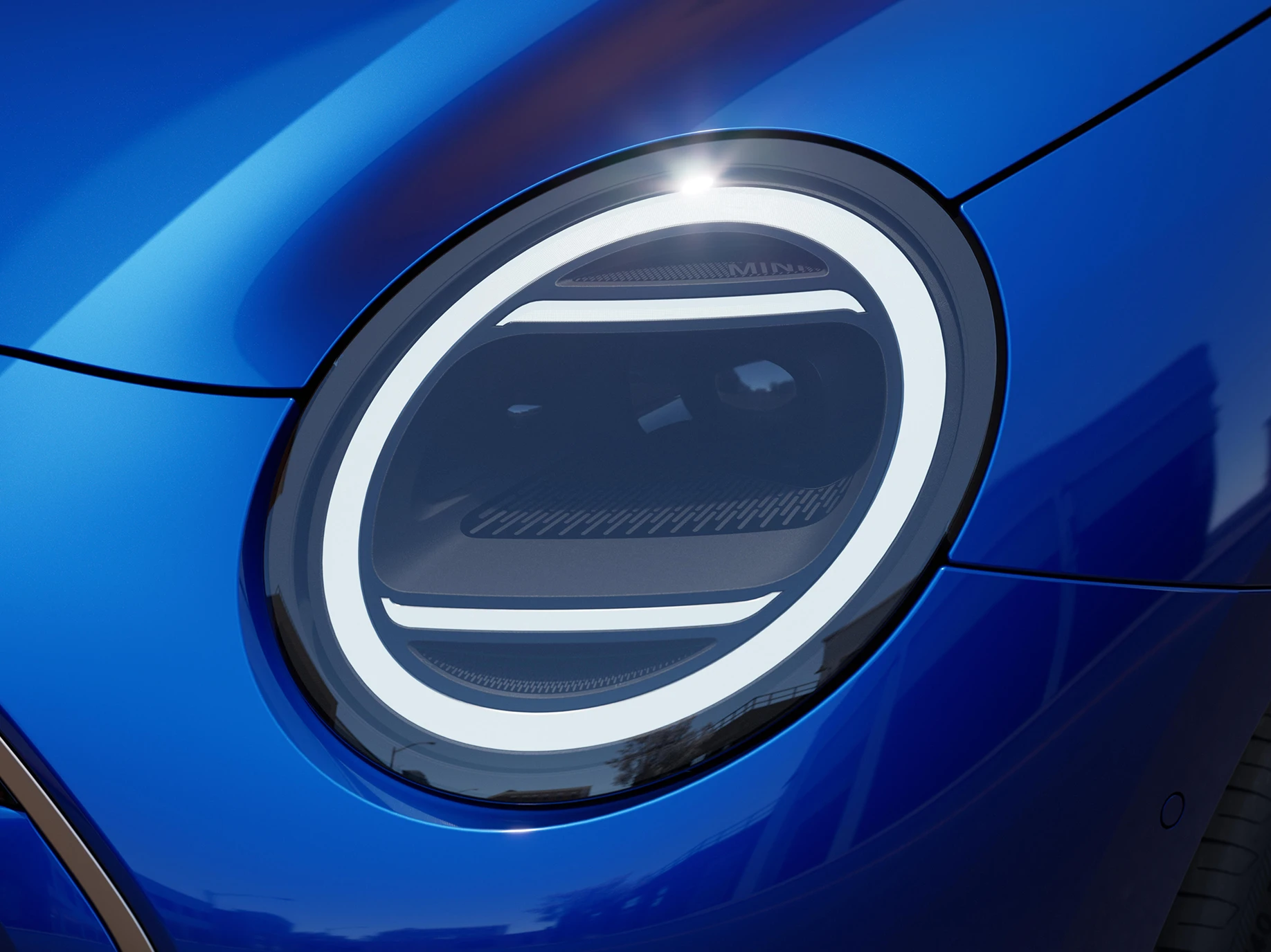 Close view of the all-electric MINI Cooper headlights with Favoured Trim.