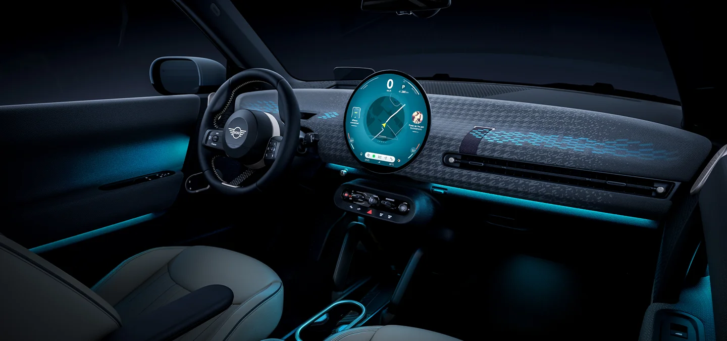 Interior view of the all-electric MINI Cooper with ambient light in blue.