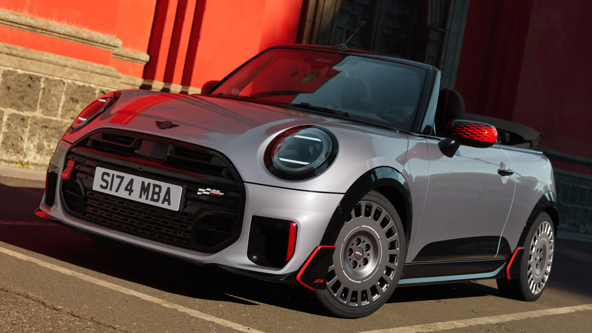 MINI Convertible in Silver boasting sporty JCW styling products including MINI JCW mirror caps, sport stripes and winglet.