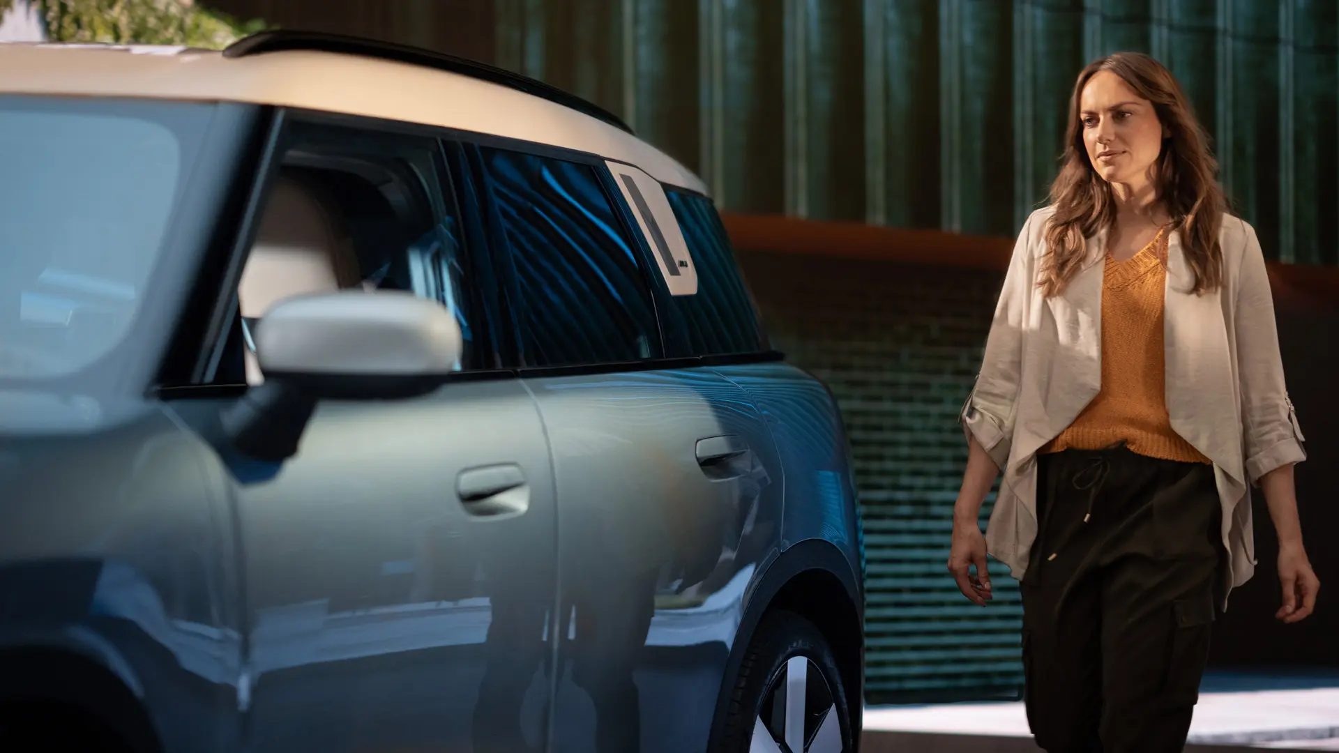 Woman customer at MINI Centre after consultation with MINI Financial Services. 