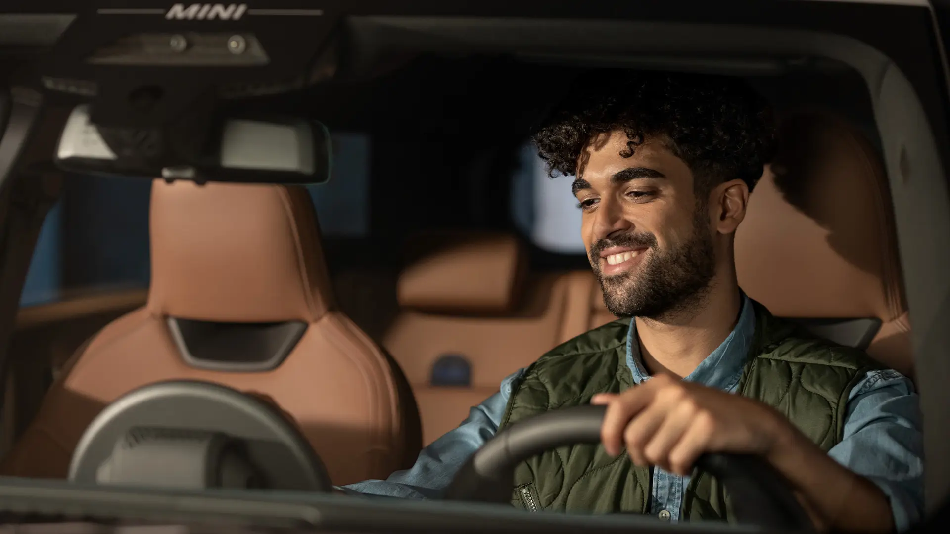 Man sitting in a MINI contacting Roadside Assistance