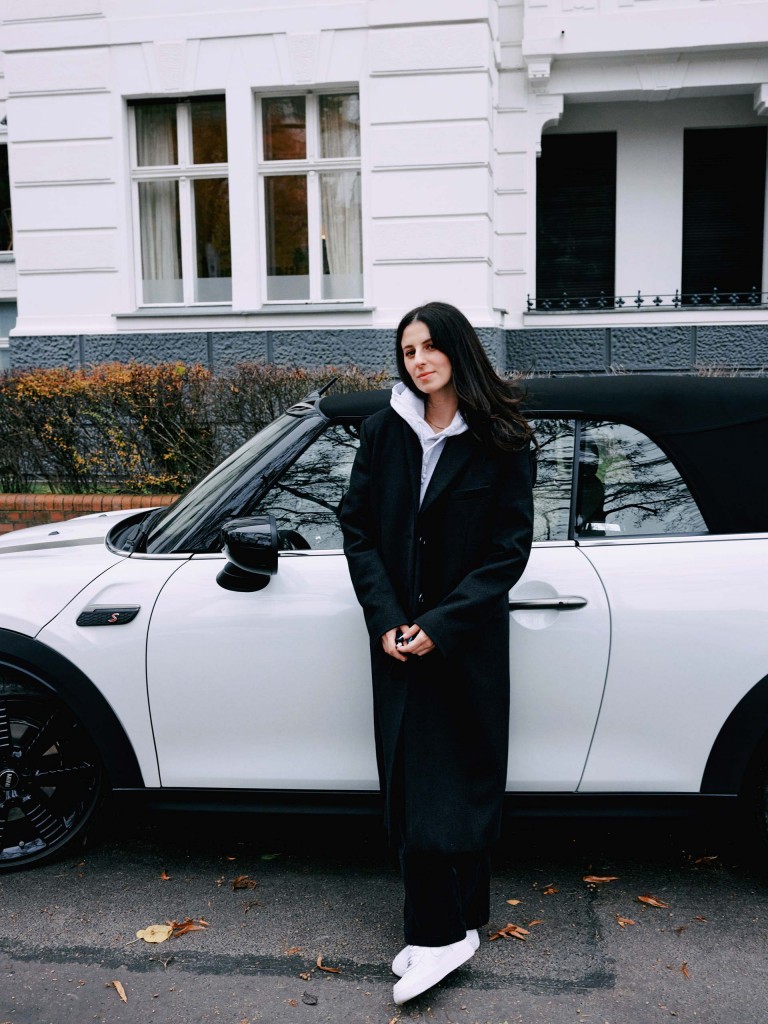 Ruby Barber and the MINI Convertible in front of her house. 